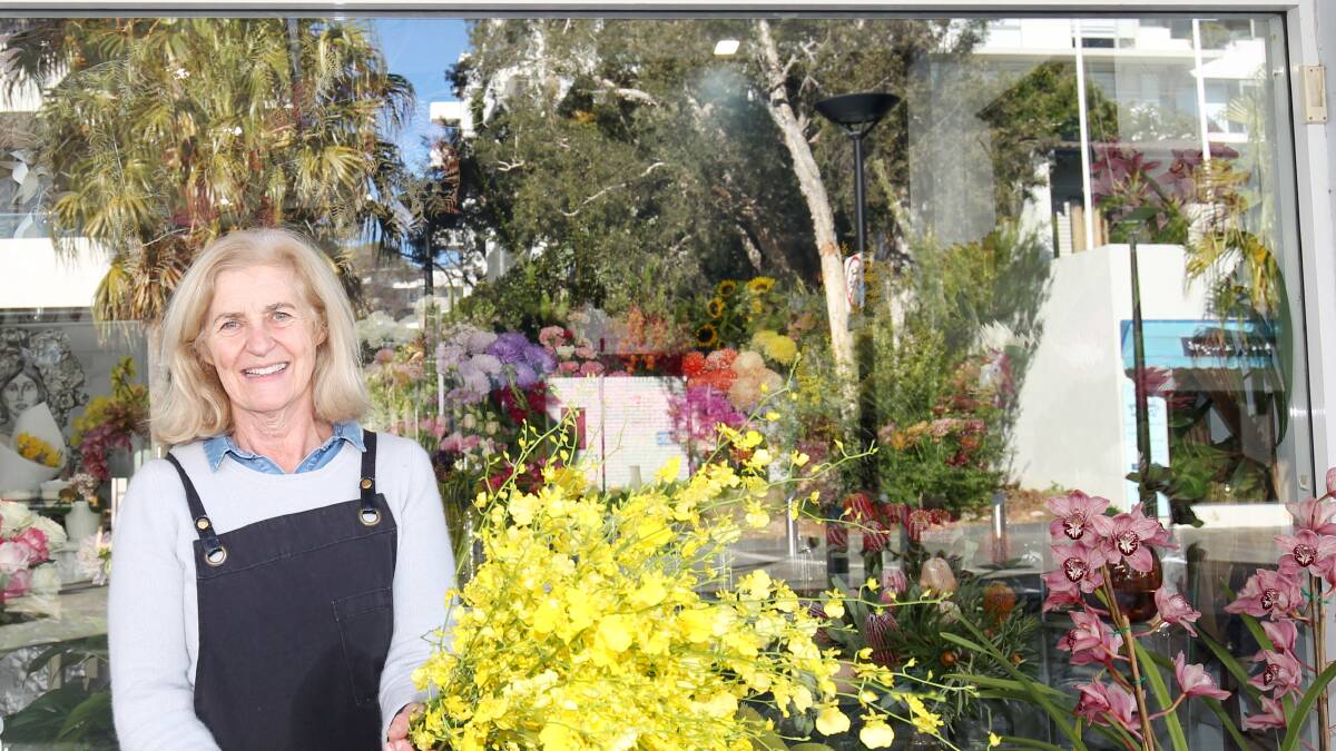 Say it with flowers: Florist Janelle Wood of Harperwood Floral Design at Cronulla is urging people to brighten someone's day with flowers. Pictures: Chris Lane 