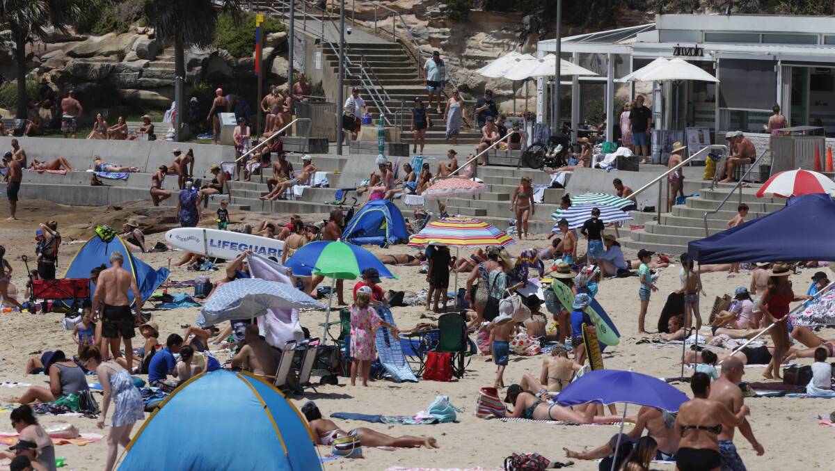 Mercury rising: Crowds flock to Cronulla's beaches for the second day in a row as temperatures reached 41 degrees in parts of St George and Sutherland Shire yesterday. Picture: John Veage