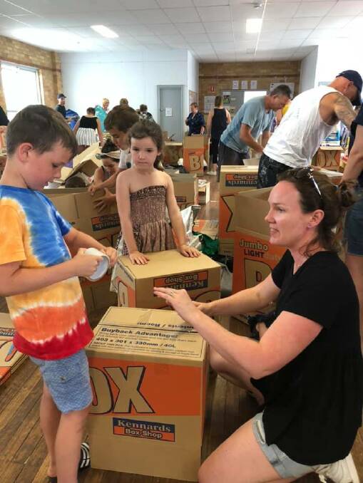 Community spirit: Volunteers toiled for days to pack the donated items before they were sent to the NSW South Coast. Picture: Facebook 