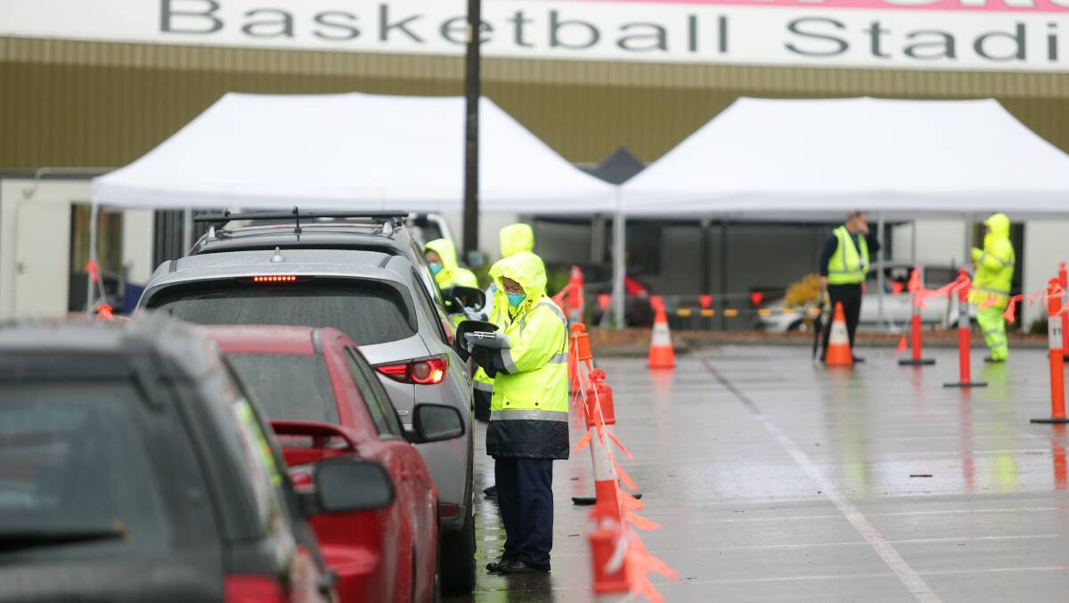 Testing urged: The NSW Health run COVID-19 drive-through testing clinic at Sutherland Basketball Stadium. Picture: Chris Lane 