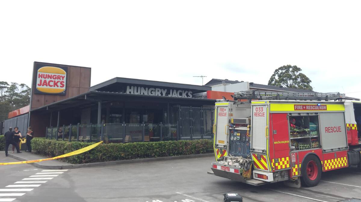 Mopping up: The Hungry Jacks restaurant at Heathcote suffered extensive damage inside after a fire broke out in the kitchen this morning. Picture: Chris Lane