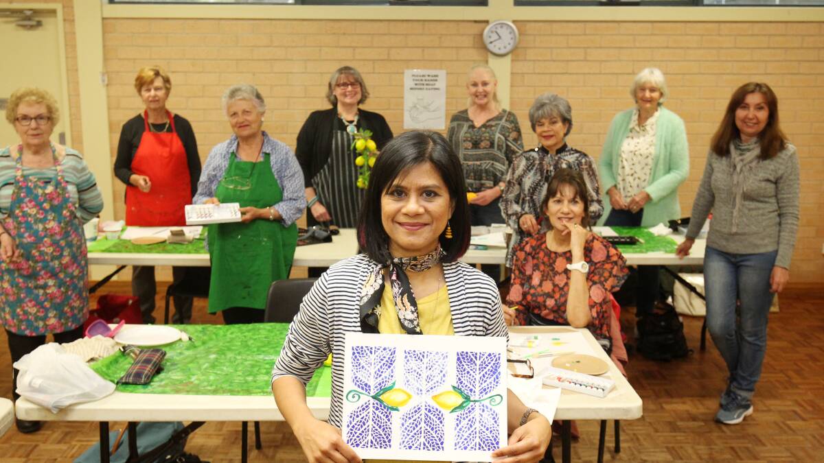 Art as therapy: Melissa Martin (centre front) with participants at an Artfully Social class at Orana. Picture: Chris Lane