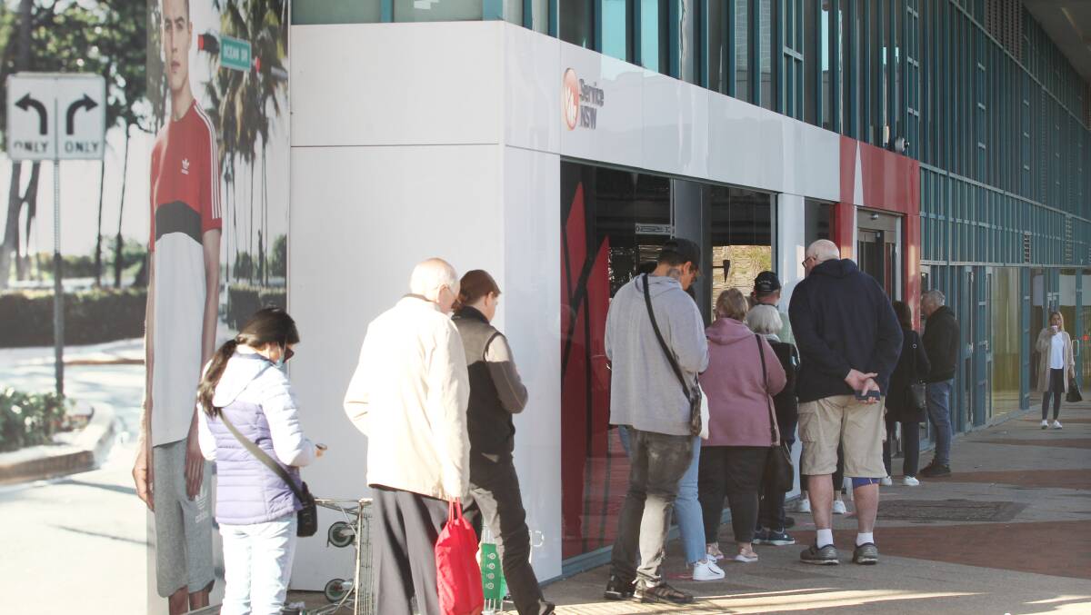 Long delays: A queue outside the Service NSW service centre at Miranda recently. Picture: Chris Lane