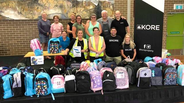 Packed with love: The Marton Street Public School community with some of the back-to-school supplies collected for those affected by bushfire and drought. Picture: Supplied