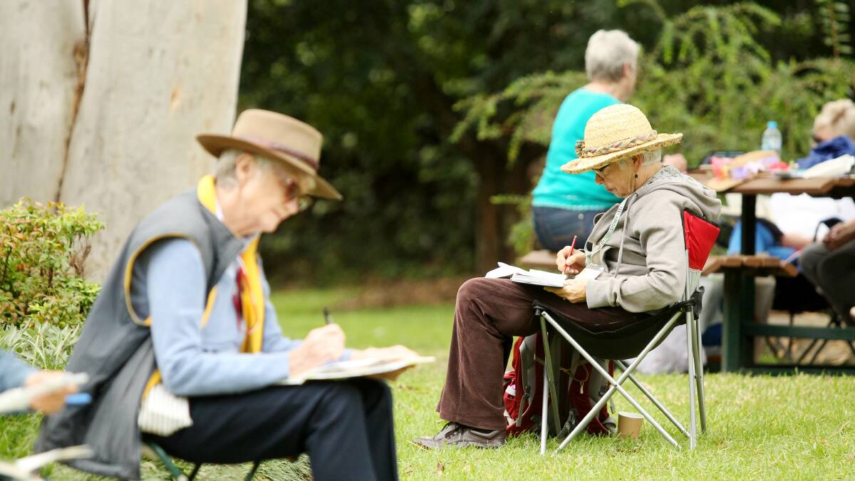 Savvy seniors: Seniors take part in an outdoor sketching class at EG Waterhouse Camellia Gardens at Caringbah on Saturday. Picture: Chris Lane
