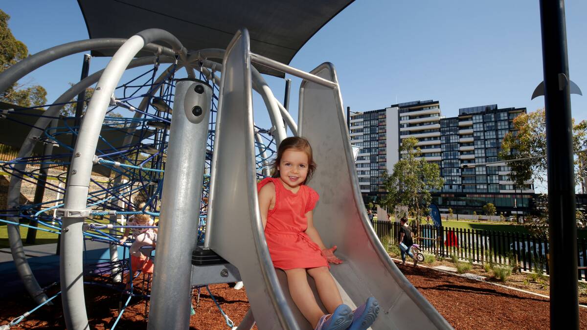 Something for everyone: The new park at South Village Kirrawee has a large green space and children's play area. Pictures: Chris Lane