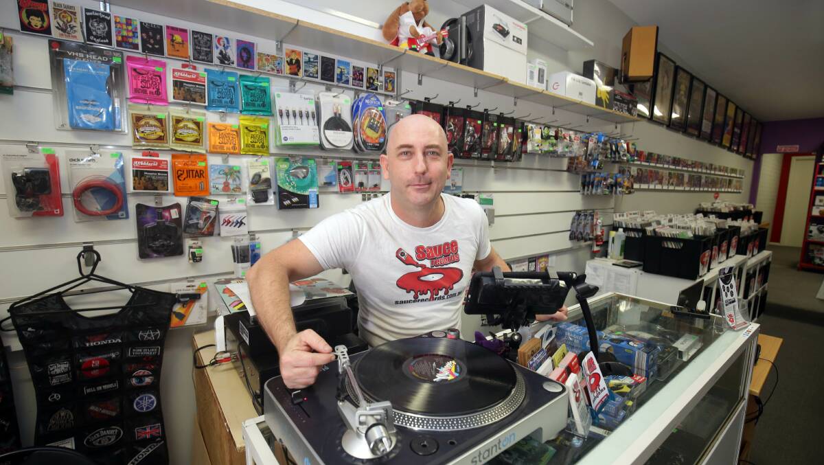 Spinning round: Shane McGlinchy has put his faith in rising vinyl record sales and opened a new record store in Jannali. Picture: Chris Lane 