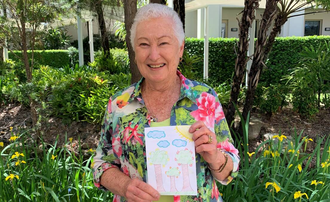 Some of the residents of Ardency Aroona retirement village at Yowie Bay with cards and letters they received from South Australian school students. Pictures: Supplied