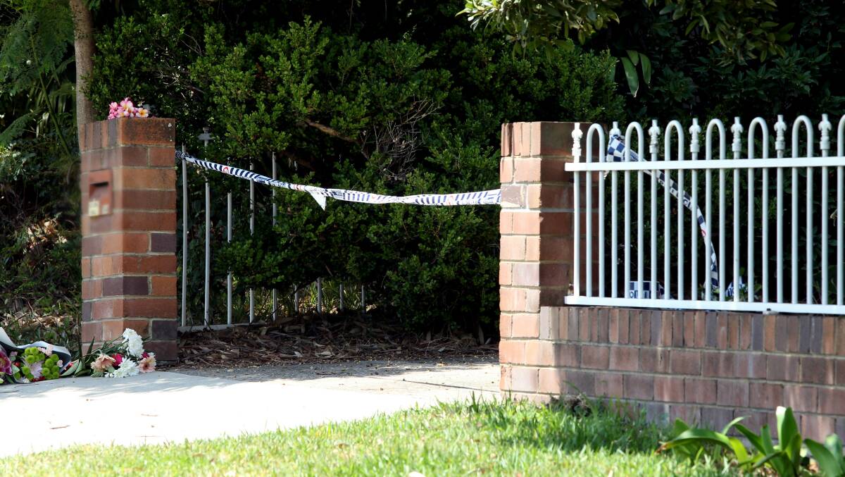 Solemn sight: Floral tributes have been left outside the home on the Kingsway at Woolooware. Picture: Chris Lane 