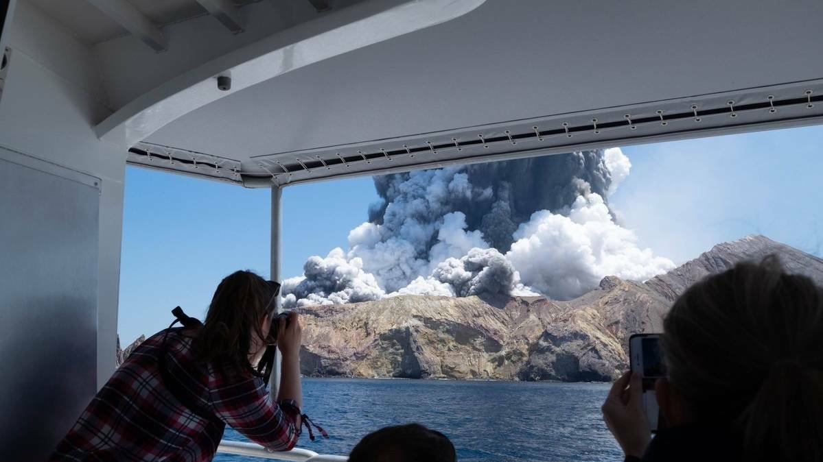 Disaster: This image was taken moments after the volcano eruption on New Zealand's White Island. Picture: Michael Schade via Twitter 