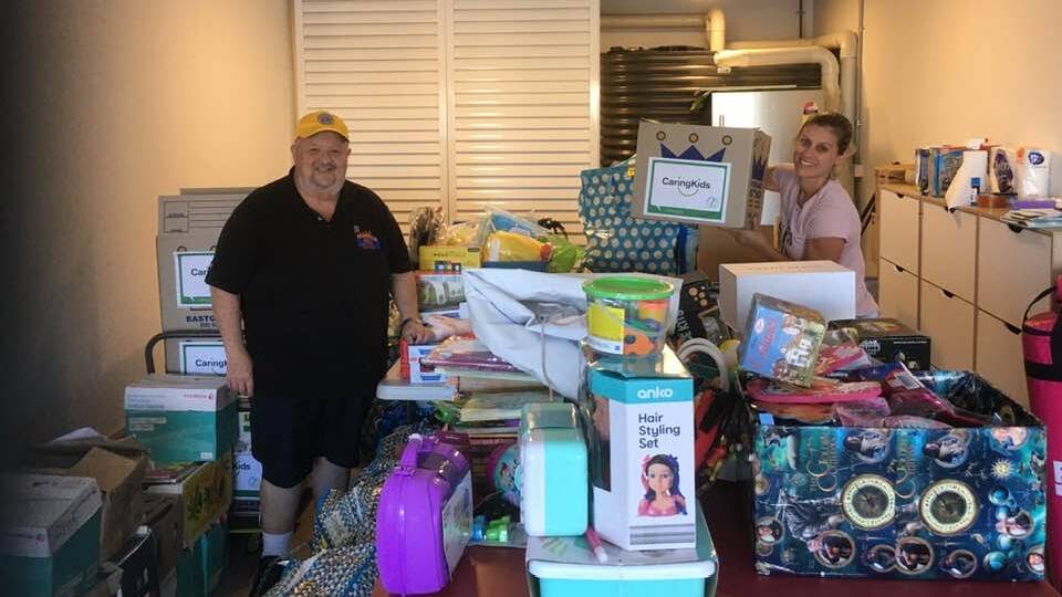 Kind act: Lugarno Lions Club's Elvio Munzone recently delivered books to CaringKids. Picture: Supplied