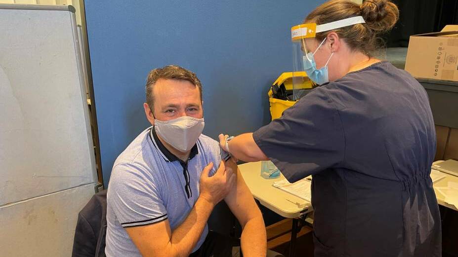 Getting the jab: State MP for Rockdale Steve Kamper getting the jab at the walk-in vaccination hub at Rockdale Town Hall.