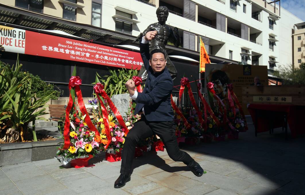 Sam Luo, president of World Dragon Club Australia performing martial arts at the Kogarah Town Square ceremony. Picture: Chris Lane