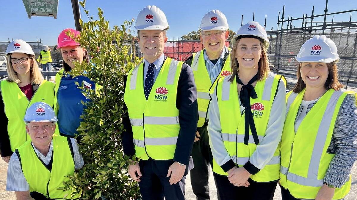 Mark Speakman with staff members at topping out ceremony on 15 July for new Sutherland Hospital building.