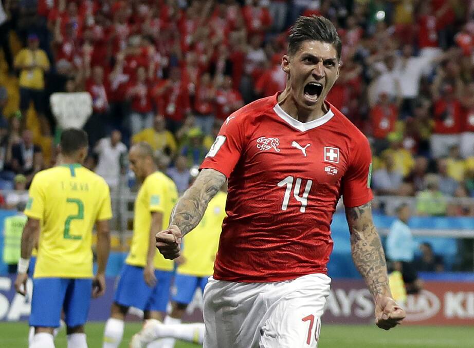 Switzerland's Steven Zuber celebrates after scoring his side's opening goal during the group E match between Brazil and Switzerland. Picture: Themba Hadebe