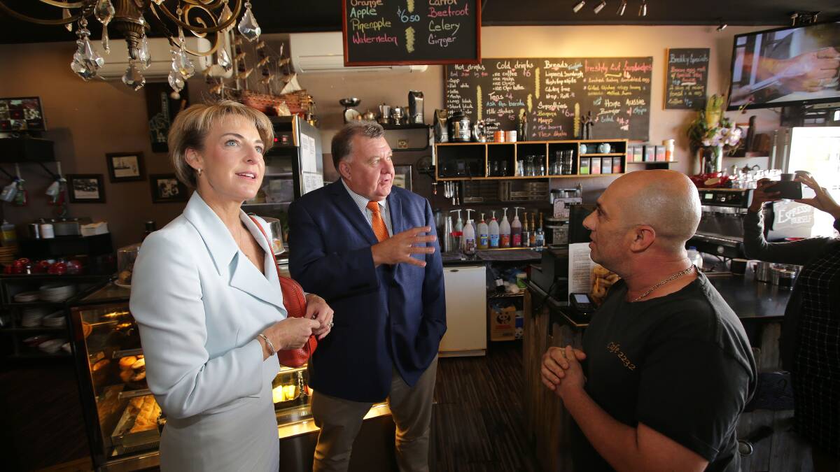 Listening to business: Federal Minister for Employment, Senator Michaelia Cash and Hughes MP Craig Kelly visit 2232 cafe-owner, George Papadopoulos in Sutherland yesterday. During her visit she announced details of a new Employability Skills Training program for youth. Picture:  John Veage