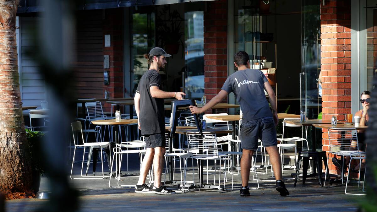 Table service: While cafes can open earllier, under the trial they will not be able to set up outdoor furniture until 6.30am. Picture: John Veage