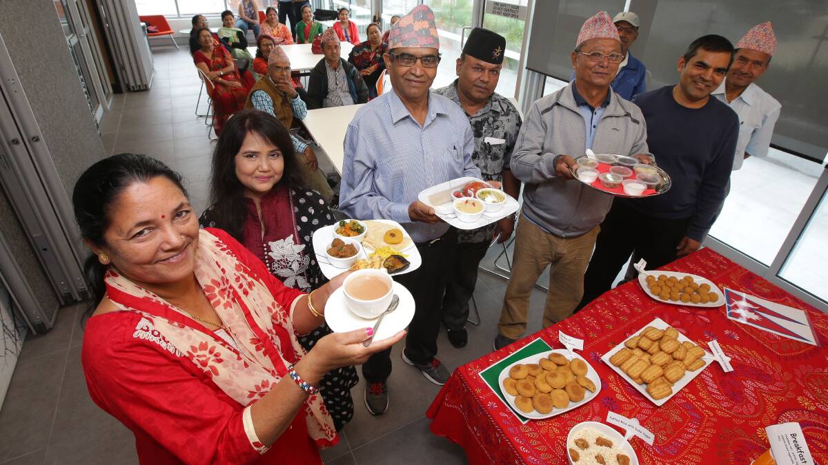 Cultural harmony: Mankmari Kandel, Tahmida Istam, Laxman Kandel and Harka Kark join others in celebrating a Bengali and Nepalese tea ceremony. Picture: John Veage