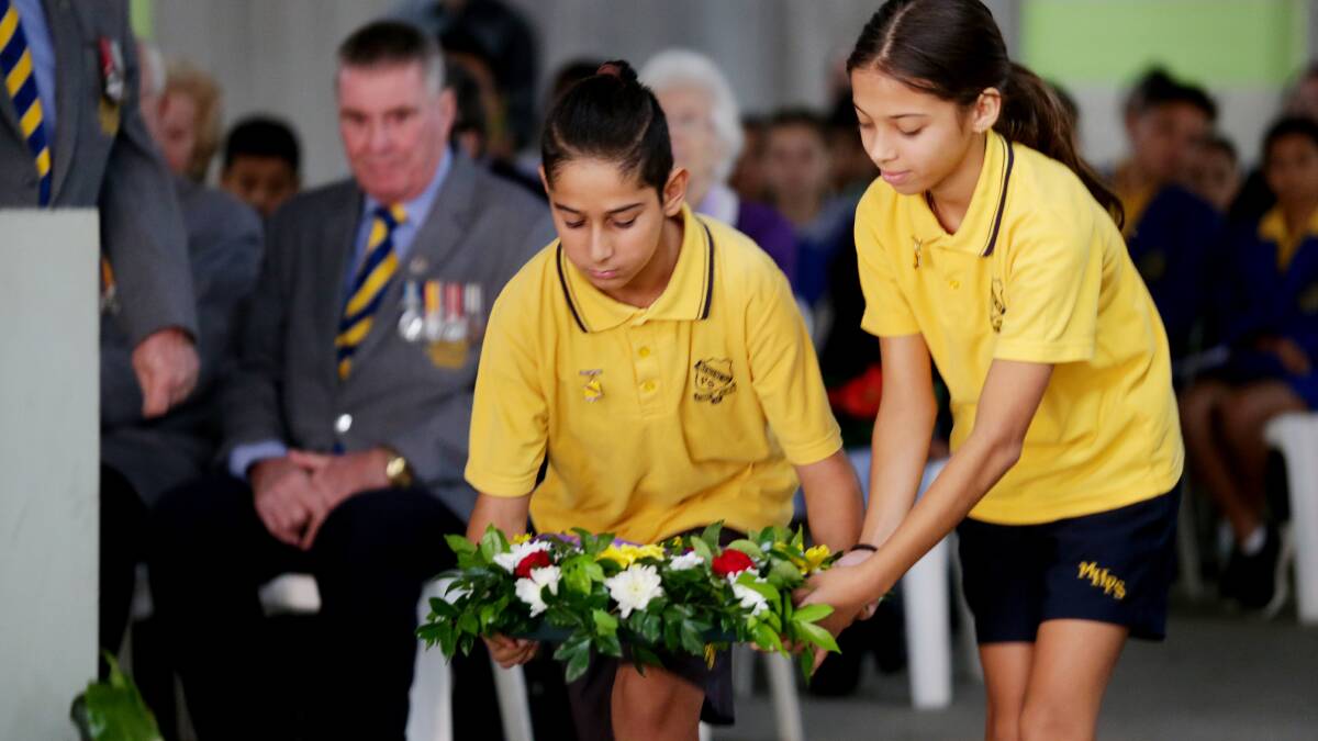 Students took part in a special ANZAC service at Kingsgrove RSL. Pictures: Chris Lane