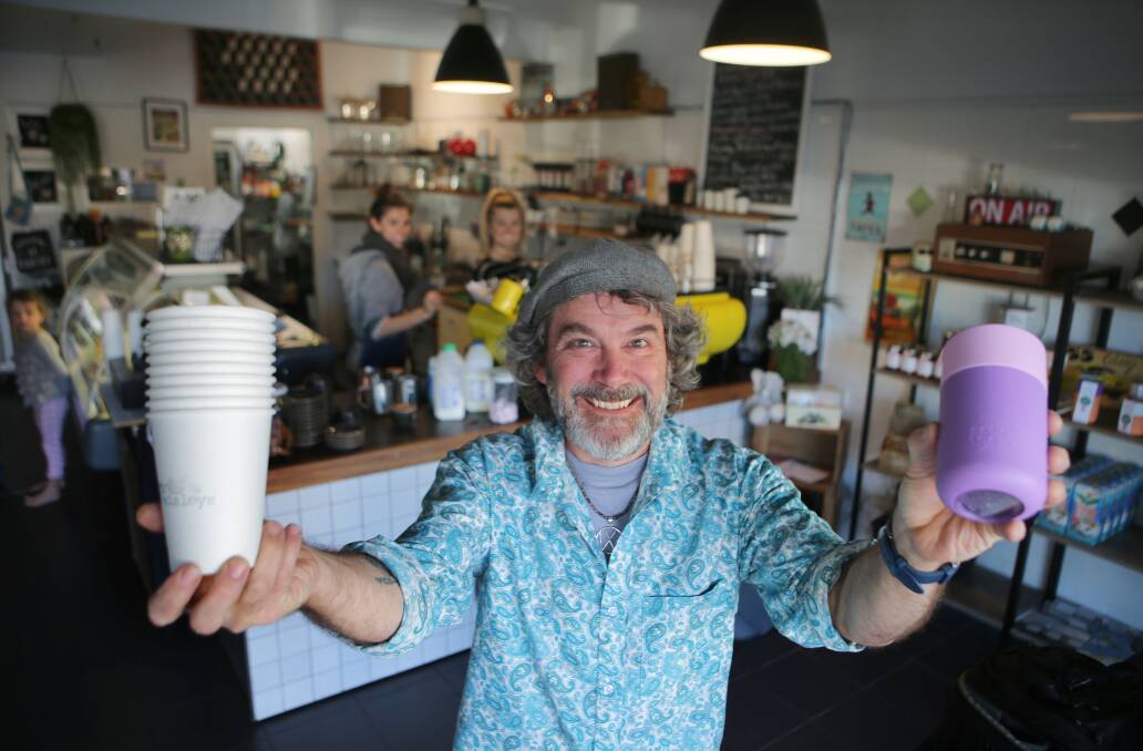 Waste conscious: Peter Nolan from Mr Paisley's Cafe in Caringbah. The cafe offers a 50 cent discount for customers who bring their own coffee cup. Picture: John Veage