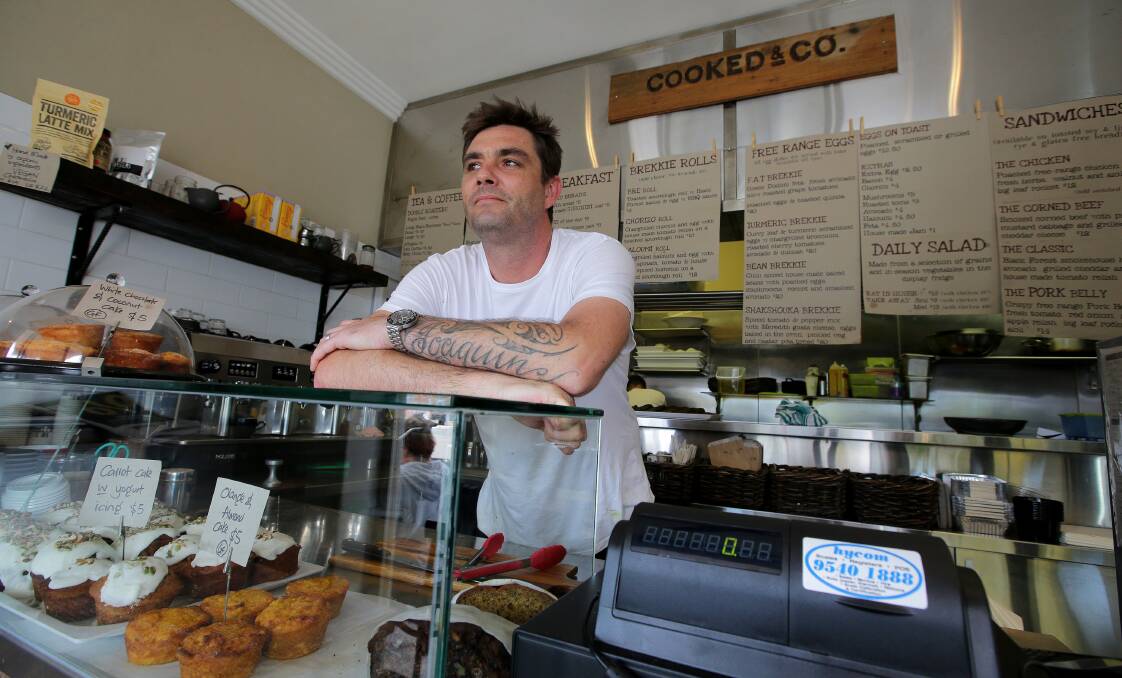 Disappointed: Cooked and Co owner Luke Phillips with the new till after the previous one was stolen. Picture: John Veage.