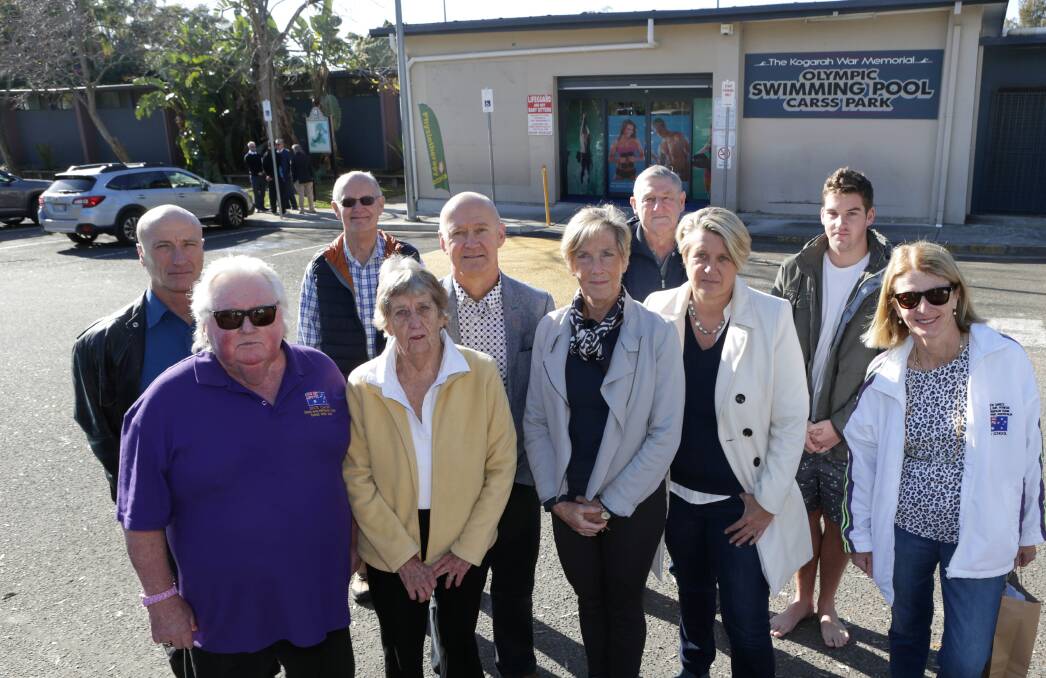 Call for consultation: Dick Caine, left, and Michelle Ford, centre, with supporters outside the Kogarah War Memorial Olympic Swimming Pool at Carss Park. Picture: John Veage