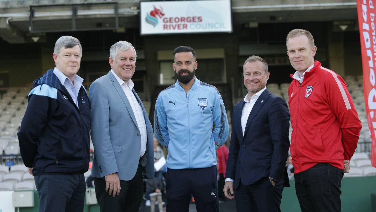 Financial boost: from left, Sutherland Shire Football Association general manager Jeff Stewart, Georges River Council mayor Kevin Greene, Sydney FC captain Alex Brosque, Sydney FC CEO Danny Townsend and St George Football Association general manager Craig Kiely. Picture: John Veage
