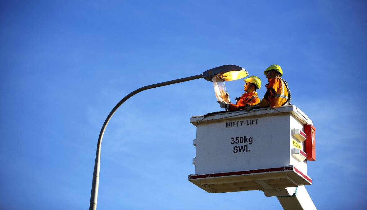 Lighting the way: Ausgrid staf changing streetlights to LEDs. Bayside Council has agreed to fast-track the introduction of the lights on residential streets over the next three years. 