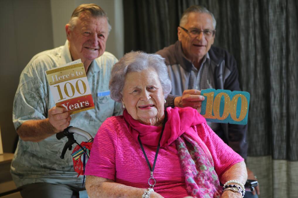 Kingsgrove legend: Lelia Pearson, is celebrating her 100th birthday today with family and friends including many nieces and nephews and her two sons, Bill and Garry, pictured. Picture: John Veage
