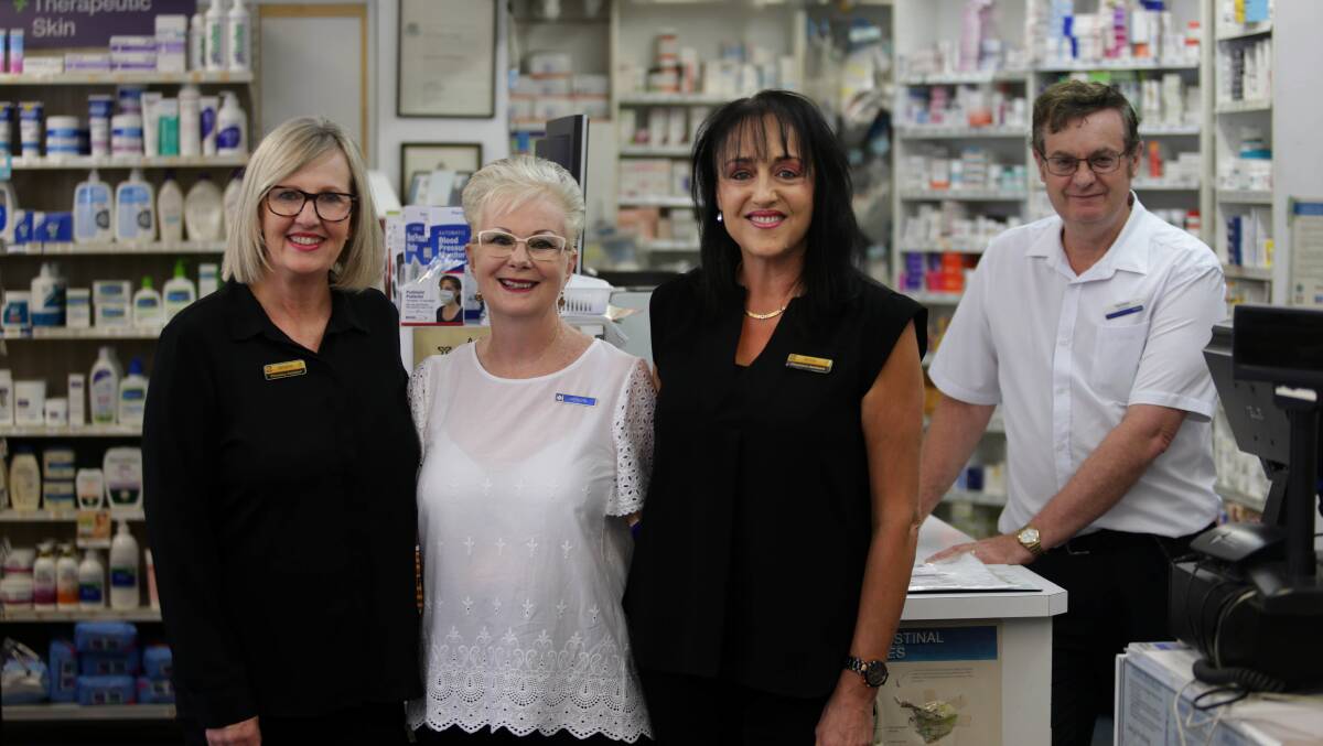 Working well together: The three shop assistants who have worked together for a combined 128 years, from left, Jenene Porter, Merrilyn Young and Anna Naylor with South Hurstivlle Market Pharmacy owner Paul Carey. Picture: John Veage