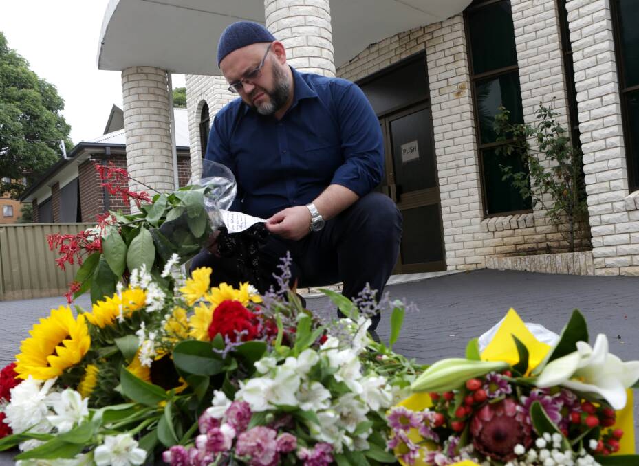 Support and solidarity: Imam Ensar Cutahija reads messages of support left at the Penshurst Mosque following last Friday's tragedy in Christchurch where at least 50 people were killed at two mosques. Picture: John Veage