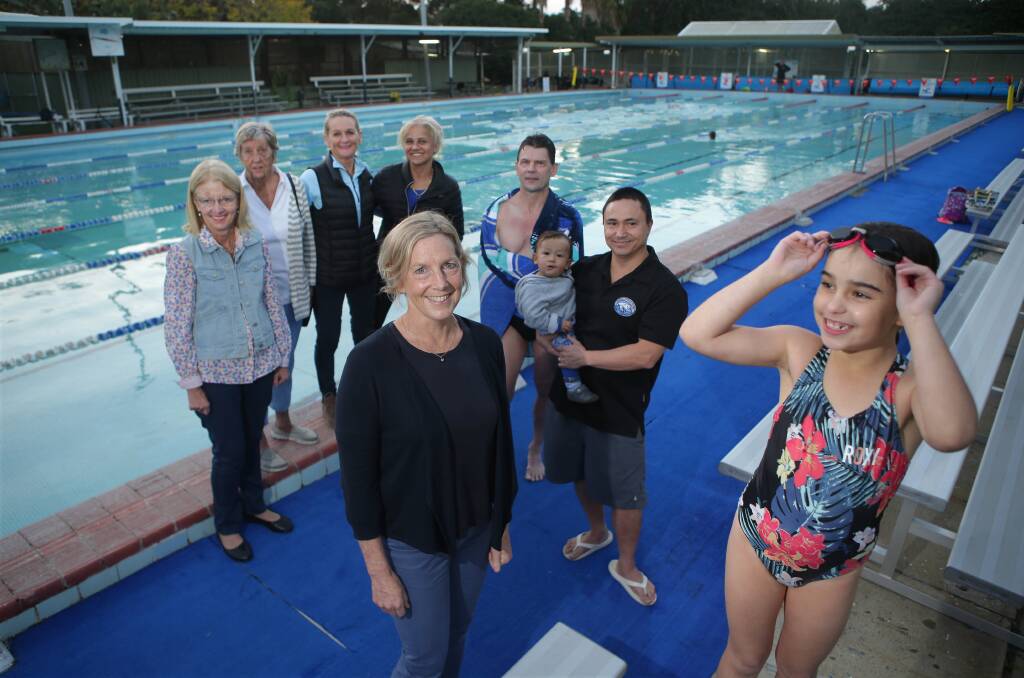 Release report: Michelle Ford (centre) and supporters inside Carss Park Pool including young swimmer Valentina, right. Picture: John Veage
