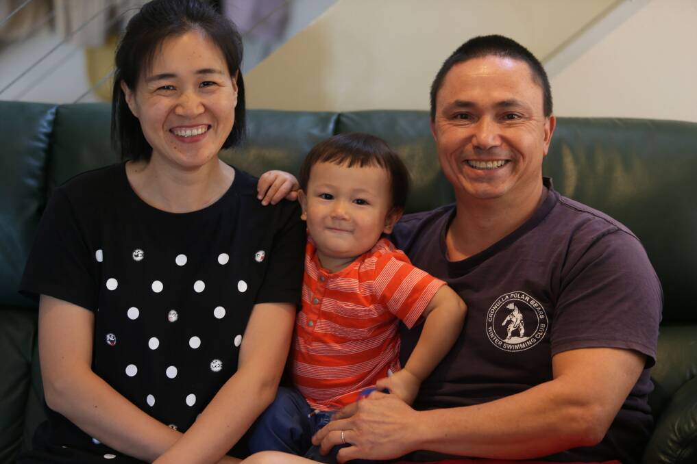 Troy Tam, wife Xiaowei and son Li cut short their trip to China because of the coronavirus. Picture: John Veage