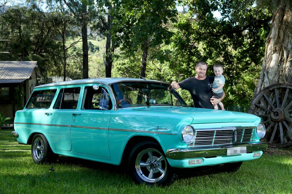 LIFETIME: Stephen Jackson, with Logan and his beloved EH Holden wagon, isn't about to give up on Holden. Picture: ADAM McLean