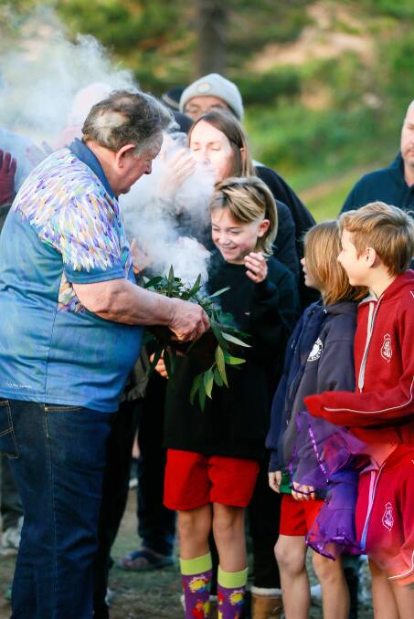 LOCAL elder Uncle Neil Evers performed a smoking ceremony. Picture: Lou Eagleton