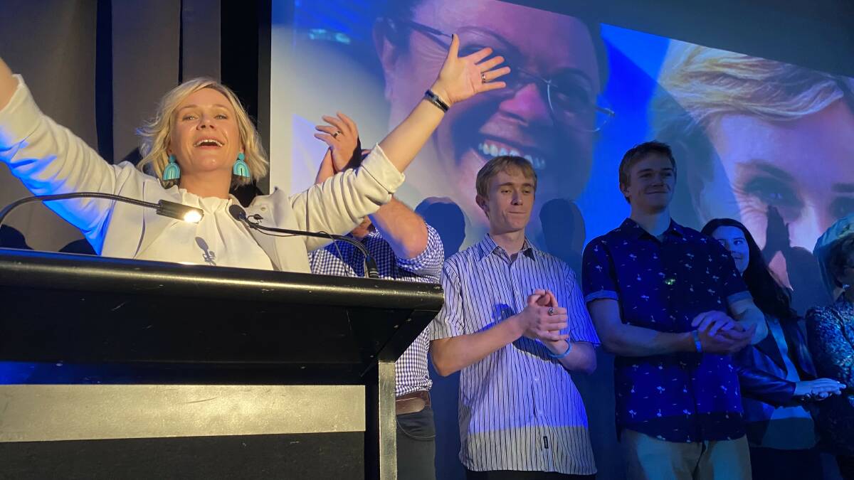 "EMOTIONAL": Zali Steggall claims victory in Warringah, alongside her husband Tim Irving and two sons. Picture: Kate Cox