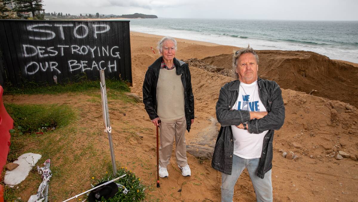 CLASH: Surfrider Foundation's Tom Kirsop and Brendan Donohoe protest construction of the sea wall at Collaroy. Picture: GEOFF JONES
