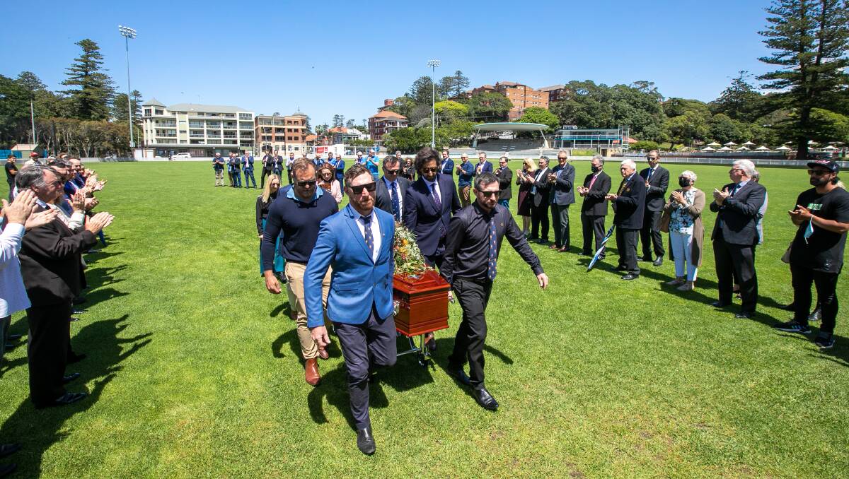 SERVICE: Russell Mackie's funeral included a final lap of Manly Oval. Picture: Geoff Jones