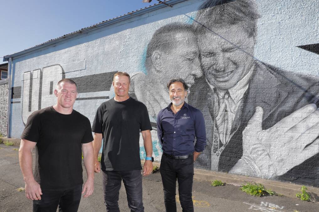 Paul Gallen, Andrew Ettingshausen and Allen Sammut in front of the mural at Cronulla. Picture by John Veage