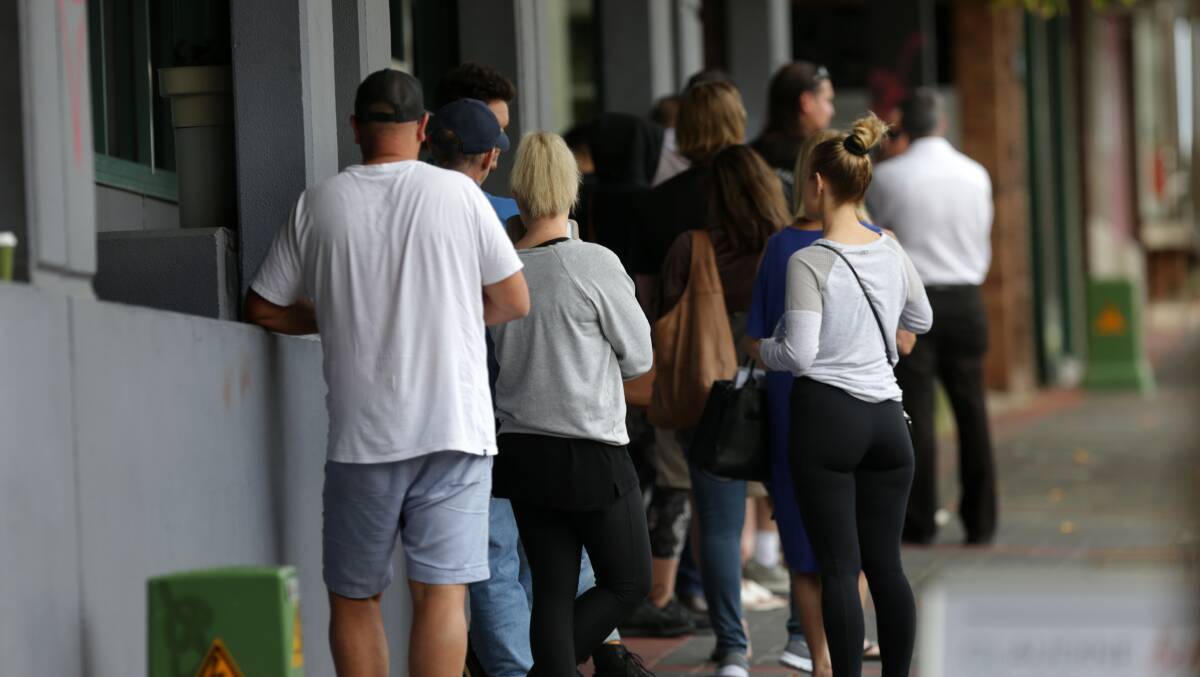 People queue outside Centrelink Caringbah on Tuesday afternoon. Picture: John Veage