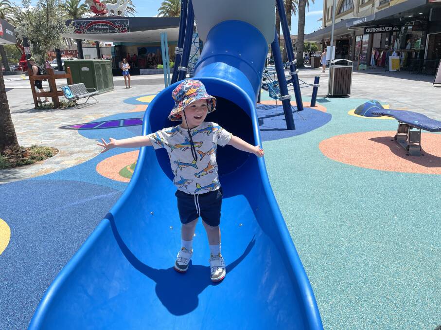 Arlo Trujillo, who is nearly three, enjoys the slide in the whale-tail playground structure. Picture by Murray Trembath