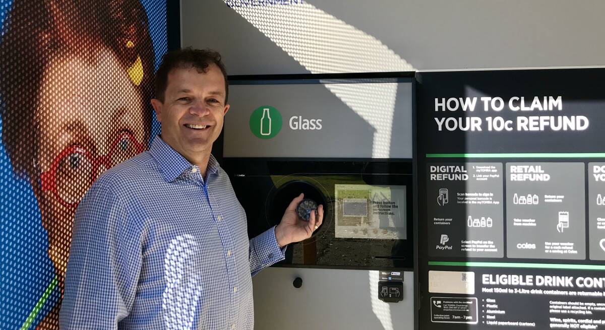 Mark Speakman at the new reverse vending machine kiosk at Caringbah Bowling and Recreation Club. picture: supplied