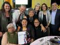 Celebrating the award are women who were involved in producing the exhibition, Byron Hurst (Hazelhurst), Deanna Schreiber (Kurranulla Aboriginal Corporation chair), mayor Carmelo Pesce, deputy mayor Carol Provan and Cr Diedree Steinwall. Picture: Facebook