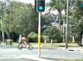 The video shows the e-bike crossing the Kingsway at traffic lights against a red signal.