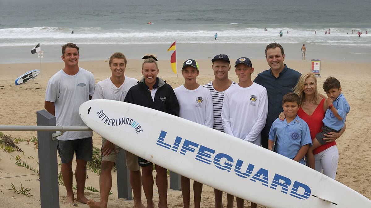 Steve and Magda Kamper and grandsons Ross and Stavros with some of the lifesavers and a lifeguard, who were involved in the mass rescue. From left -  Dane Bofinger, Will Budd (patrol captain), Lara Hughes (lifeguard), Charlie Winkelmeier, Jake Moses (patrol vice captain) and Ryan McGrath. Picture: John Veage