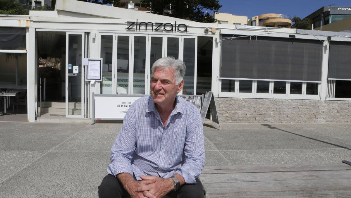 Ray Nelson, proprietor of Zimzala on Cronulla beach, where the restaurant is closed but takeaway coffee and food is still available. Picture: John Veage
