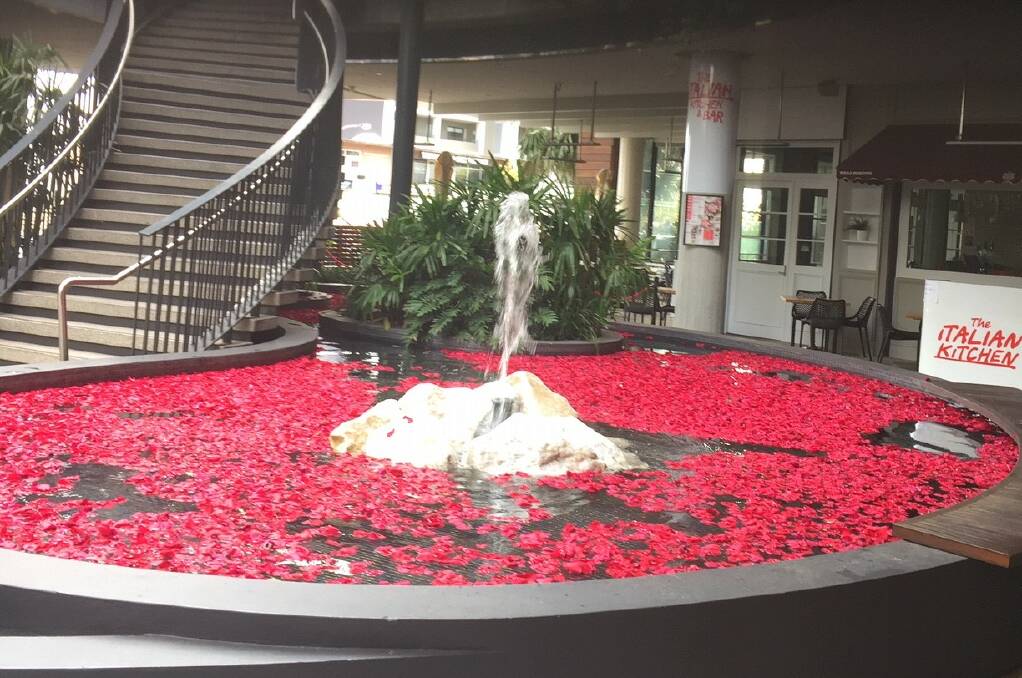 A fountain at Westfield Miranda was covered with hundreds of red flower petals. Picture: supplied