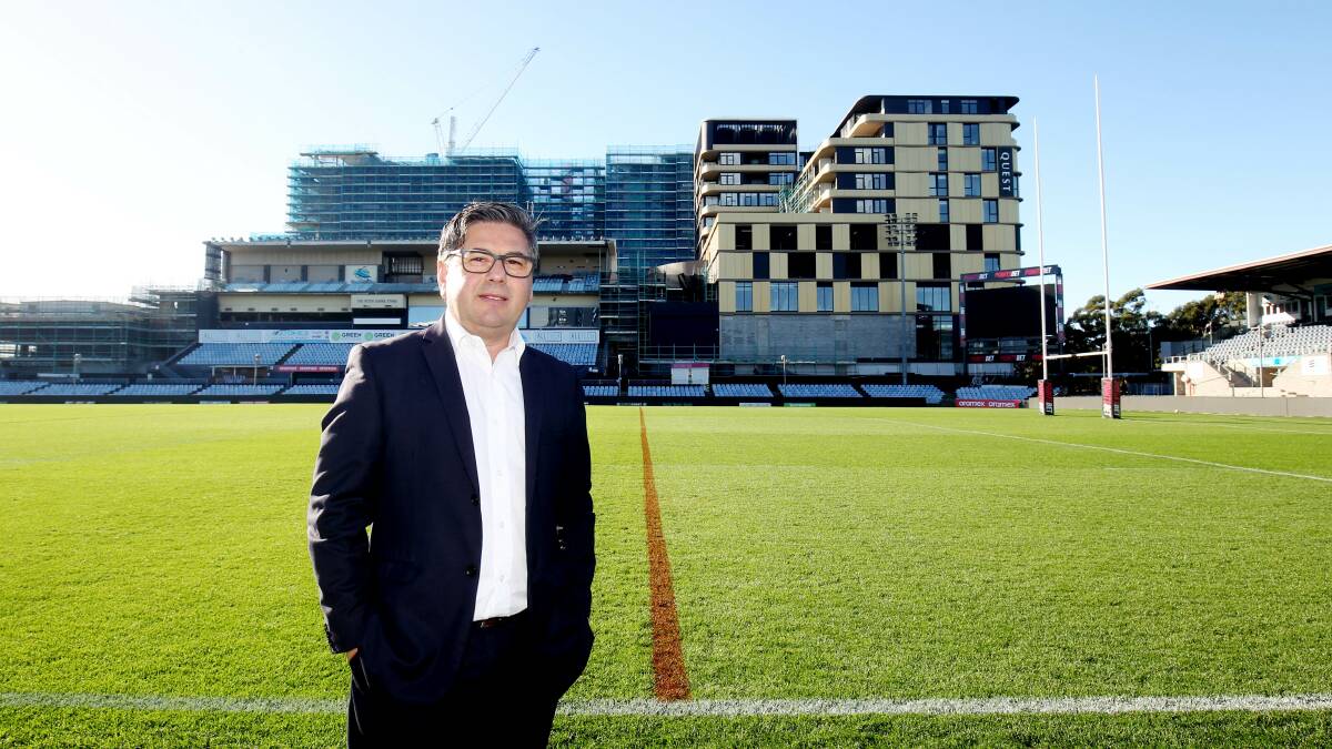 Sharks chief executive Dino Mezzatesta at PointsBet Stadium with the development in the background. Picture by Chris Lane