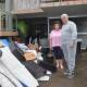 Margaret and Peter Davis with flood-damaged household items at their Woronora home.