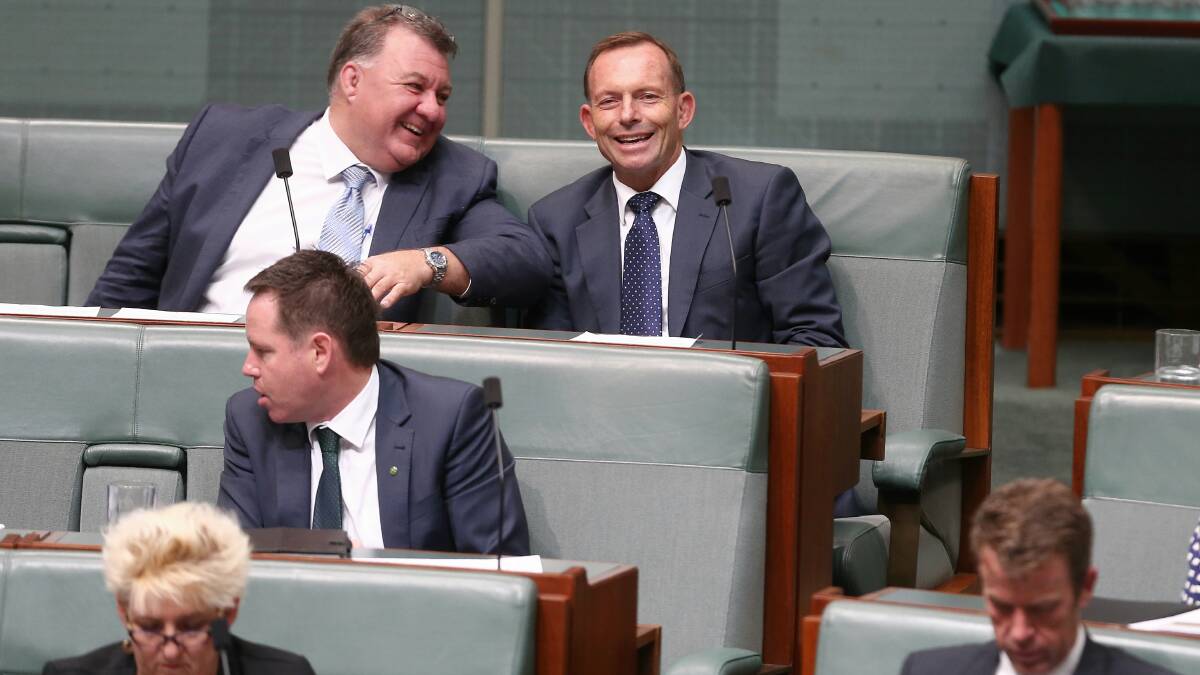 Craig Kelly and Tony Abbott during Question Time. Picture: Alex Ellinghausen